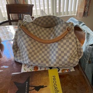 Louis Vuitton duffel bag great condition looking to get a new one.